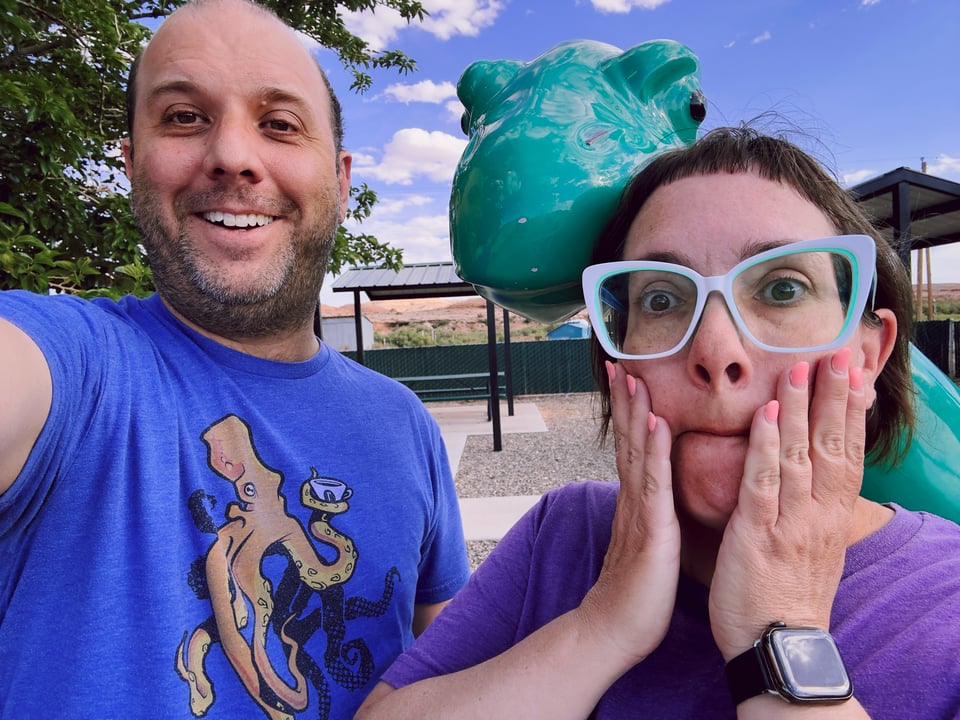Your author and his wife/driver/journey mastermind, photoed with the Sinclair gas station logo dinosaur.