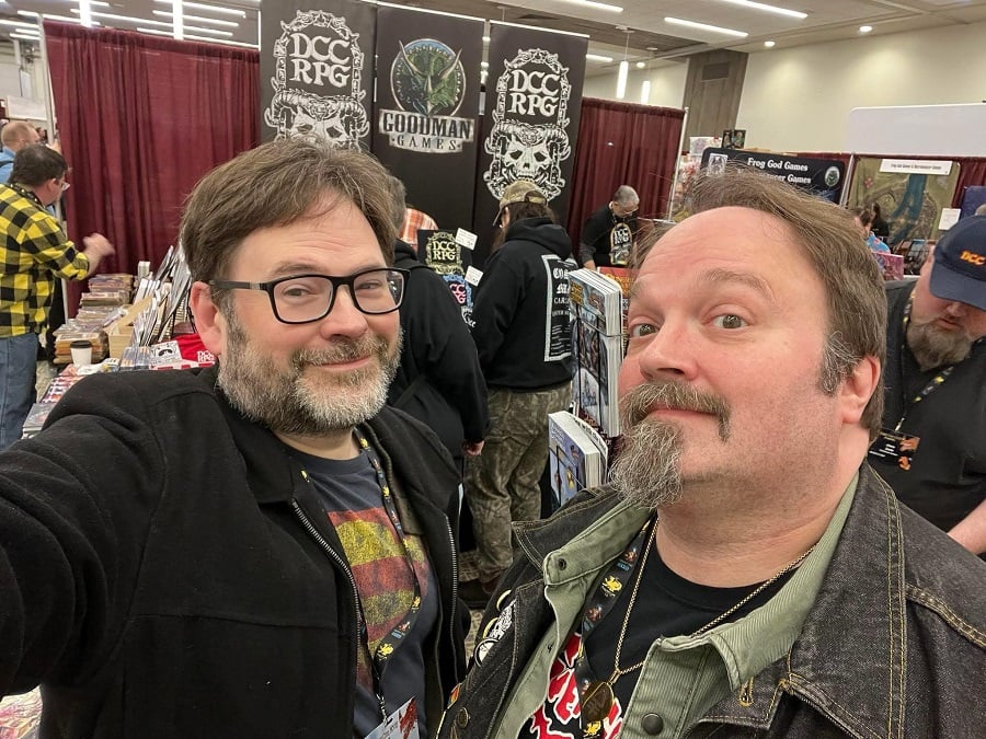 A picture of two devilishly handsome bearded men, with the Goodman Games booth in the background.