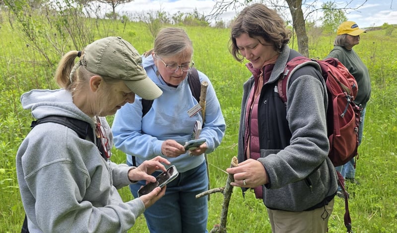 FSPA member Pam Miller, center, confabbed with fungi walk participants about phone apps one can use to enhance scientific knowledge during our May fungi walk. Thanks to all who came! / Photo by Michael Stiegler
