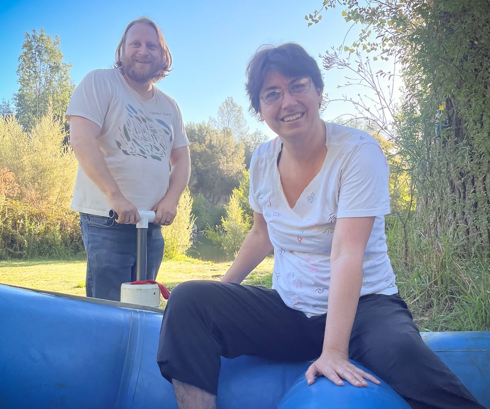 Tree and Lily posing as they prep a raft
