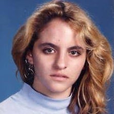 a young woman in a blue sweater