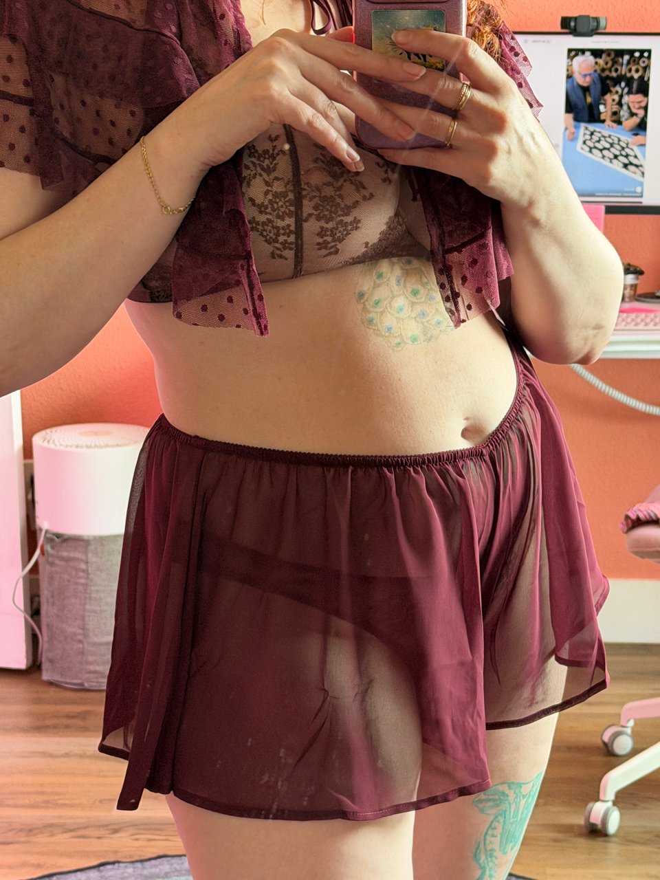 close up picture of Flora wearing burgundy lingerie