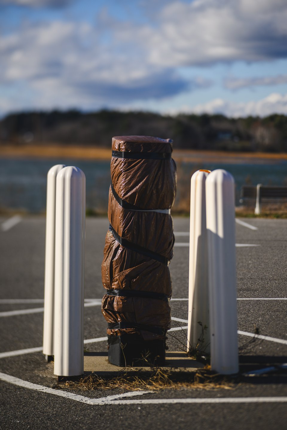 a parking meter wrapped up in plastic for the off-season