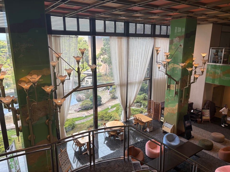A gorgeous view into a room that has ceiling to floor windows.