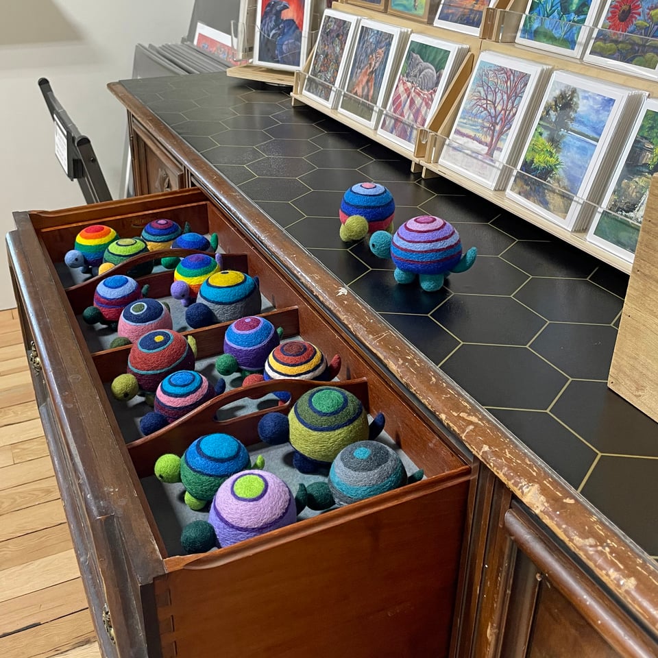 Needle-felted turtles in a drawer