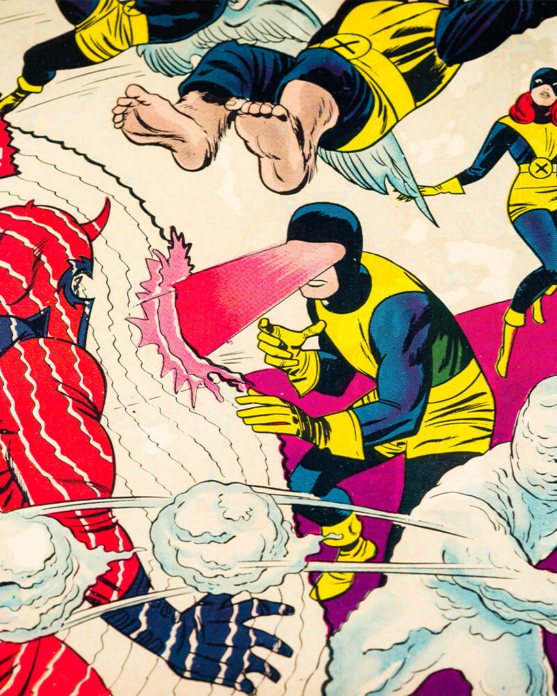 A portion of the cover to X-Men #1, circa 1963, art by Jack Kirby, featuring Iceman and Cyclops attacking Magneto