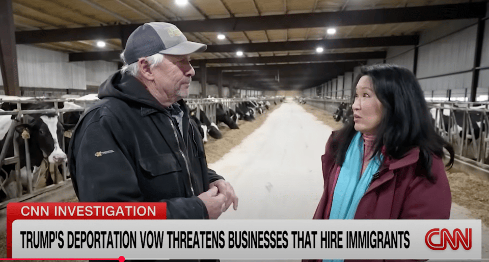Screenshot of CNN video -- South Dakota farmer in barn talking to reporter