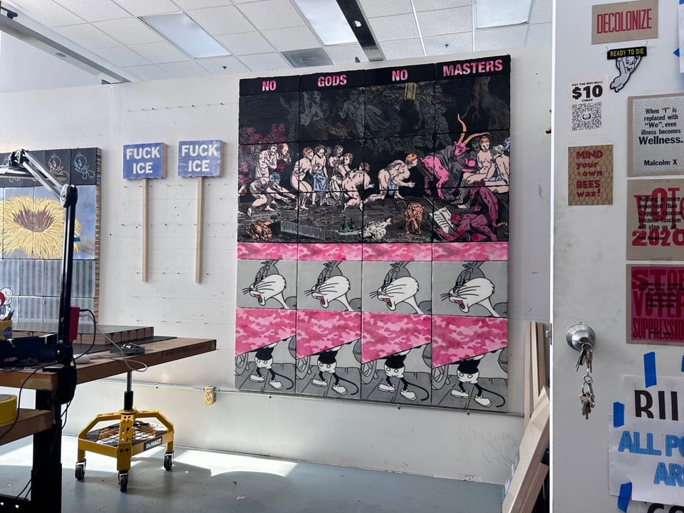 An interior shot of my studio with a few paintings on the walls. The floor is very clean.