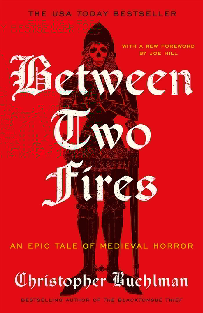 The cover of Between Two Fires. It is bright red and features a stylized depiction of a skeleton in a knight's armor. Nice title font, too.
