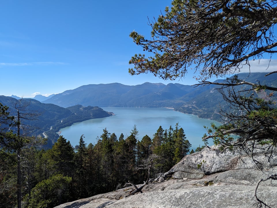 a view of a lake from the top of a mountain