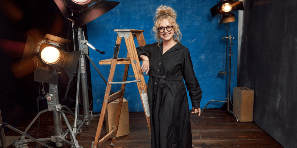 Carol Kane poses by a ladder.
