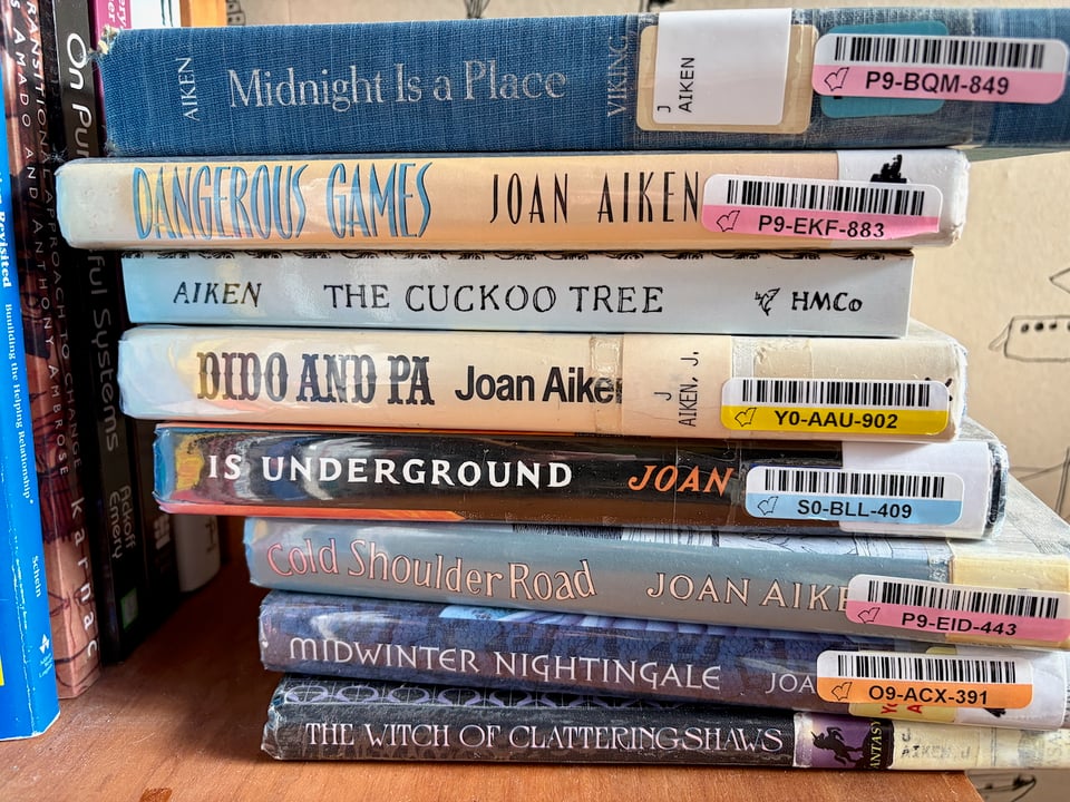 A stack of library editions of Joan Aiken books