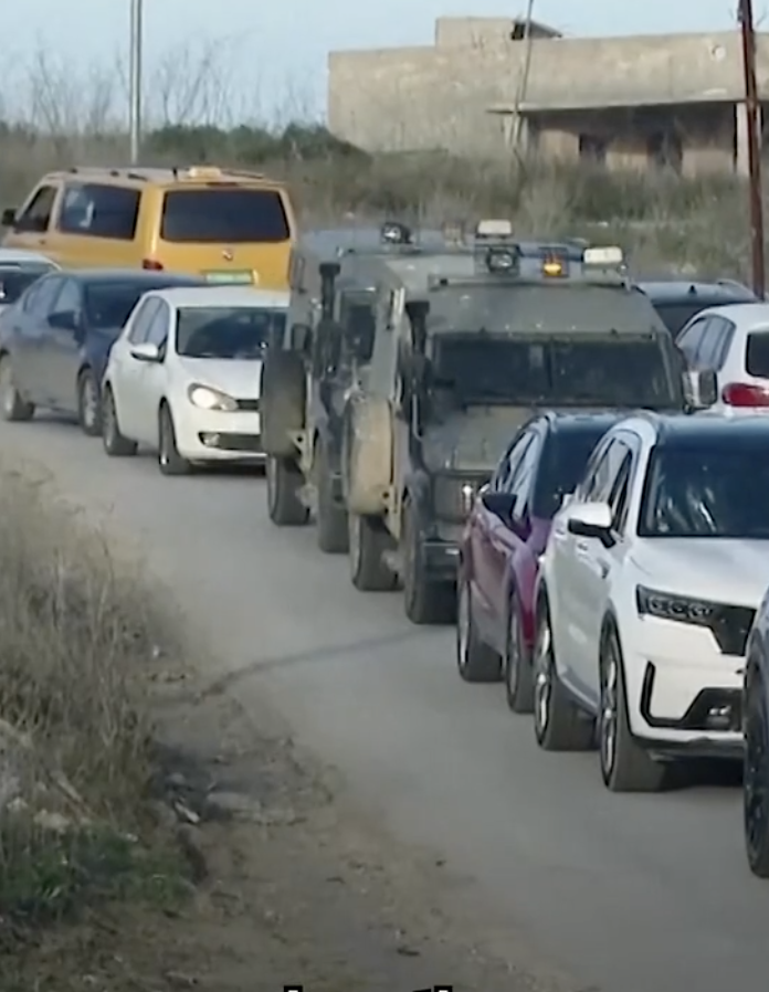 A line of cars at a standstill on a road