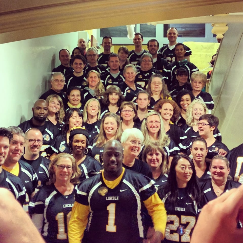 Lincoln Faculty Circa 2015 wearing football jerseys for homecoming