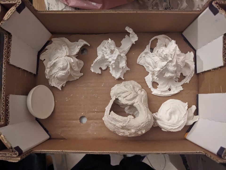 five plaster objects cast with margarine