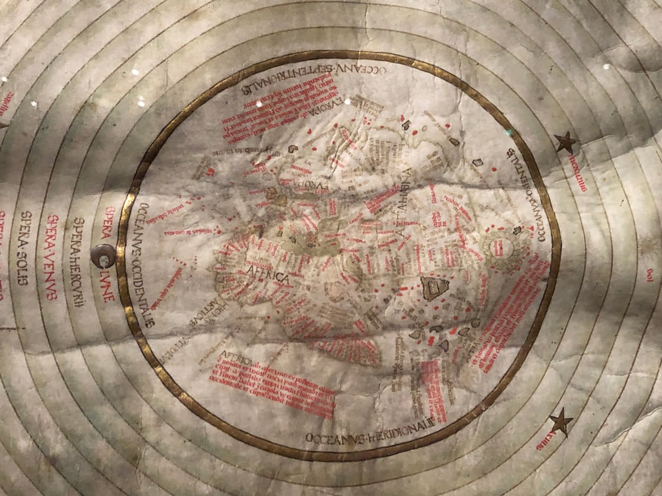 Medieval manuscript detail showing a world map with concentric circles around it.
