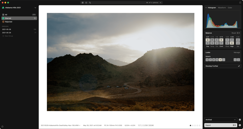 A photo of the desert and dramatic light and skies shown in the app against white.