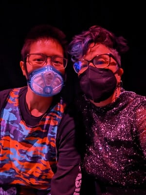 Mel Chua and Liz in 2023 at the accessible nightclub Crip Ecstasy, wearing sparkly outfits and anti-covid masks