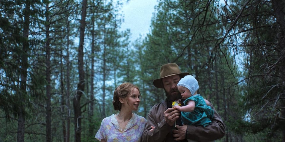 A happy family in the woods.