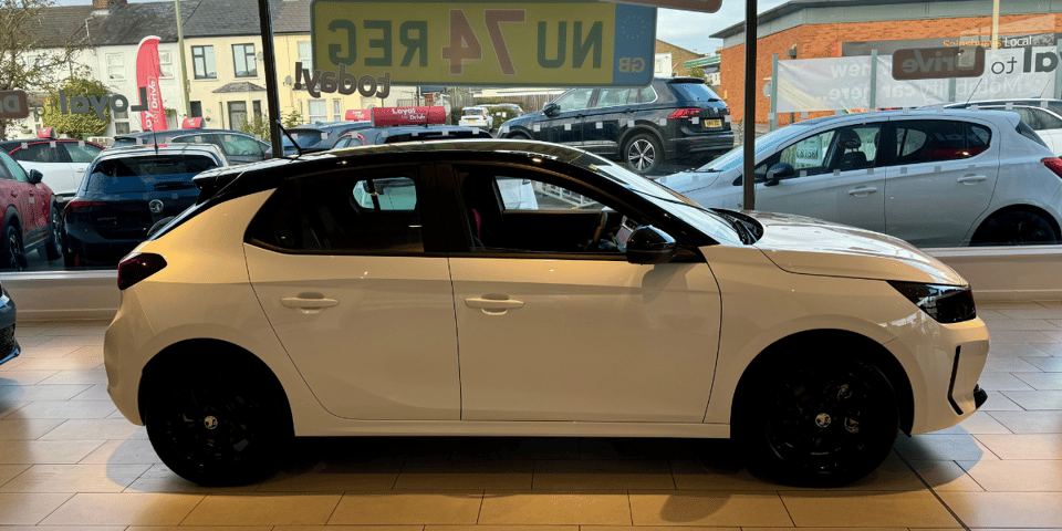 My new white electric Corsa (with contrast black roof).