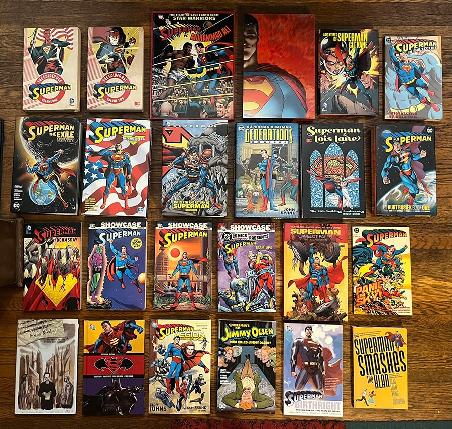 This is a photo of 24 Superman-related books that i spread out on my floor. Highlights include the Absolute All-Star Superman, The Death and Return of Superman Omnibus, Superman and the Legion of Super-Heroes, and OH! so much more!