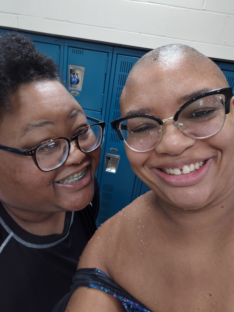 two women taking a selfie in a locker