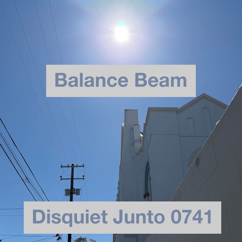 This photo shows a church on the right and a telephone pole on the left, with a bright sun up above, and the name and number of the project