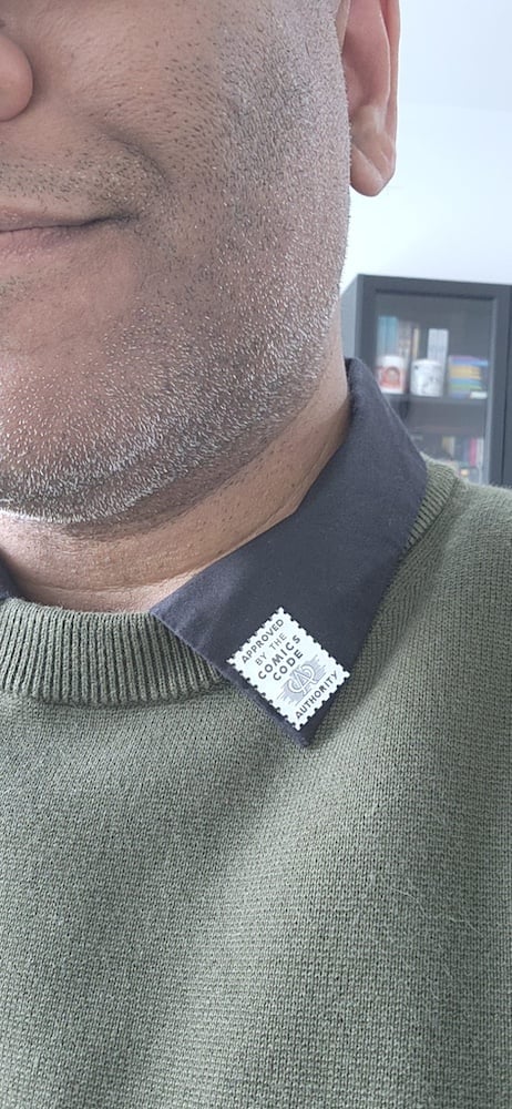 A photo of my Comics Code Authority pin.