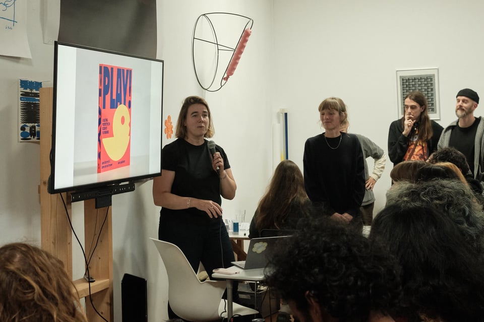 A speaker presenting in front of an audience