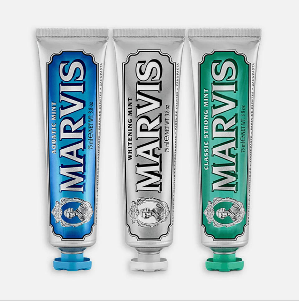 Three tubes of mint toothpaste with old-timey packaging.