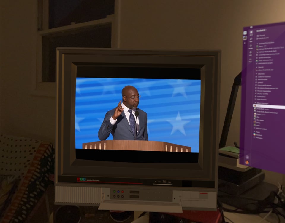 Warnock DNC speech on a virtual television