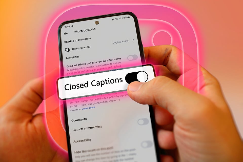 Person holding a smartphone opened to the settings page of Instagram to turn closed captions on or off. The background is a light salmon pink.