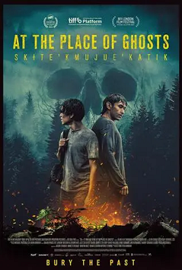 Movie poster for At the Place of Ghosts, two boys stand back to back, one holding a rifle, in a forest, with a bonfire at the forefront