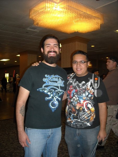 Two men in jeans and graphic t-shirts at Tucson Comic Con 2009.