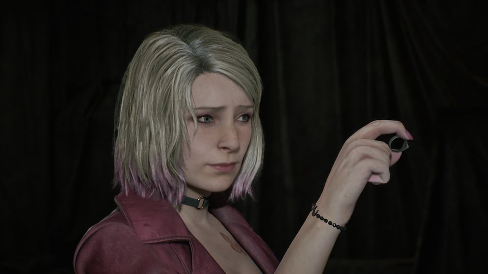 Maria looking sadly at a ring