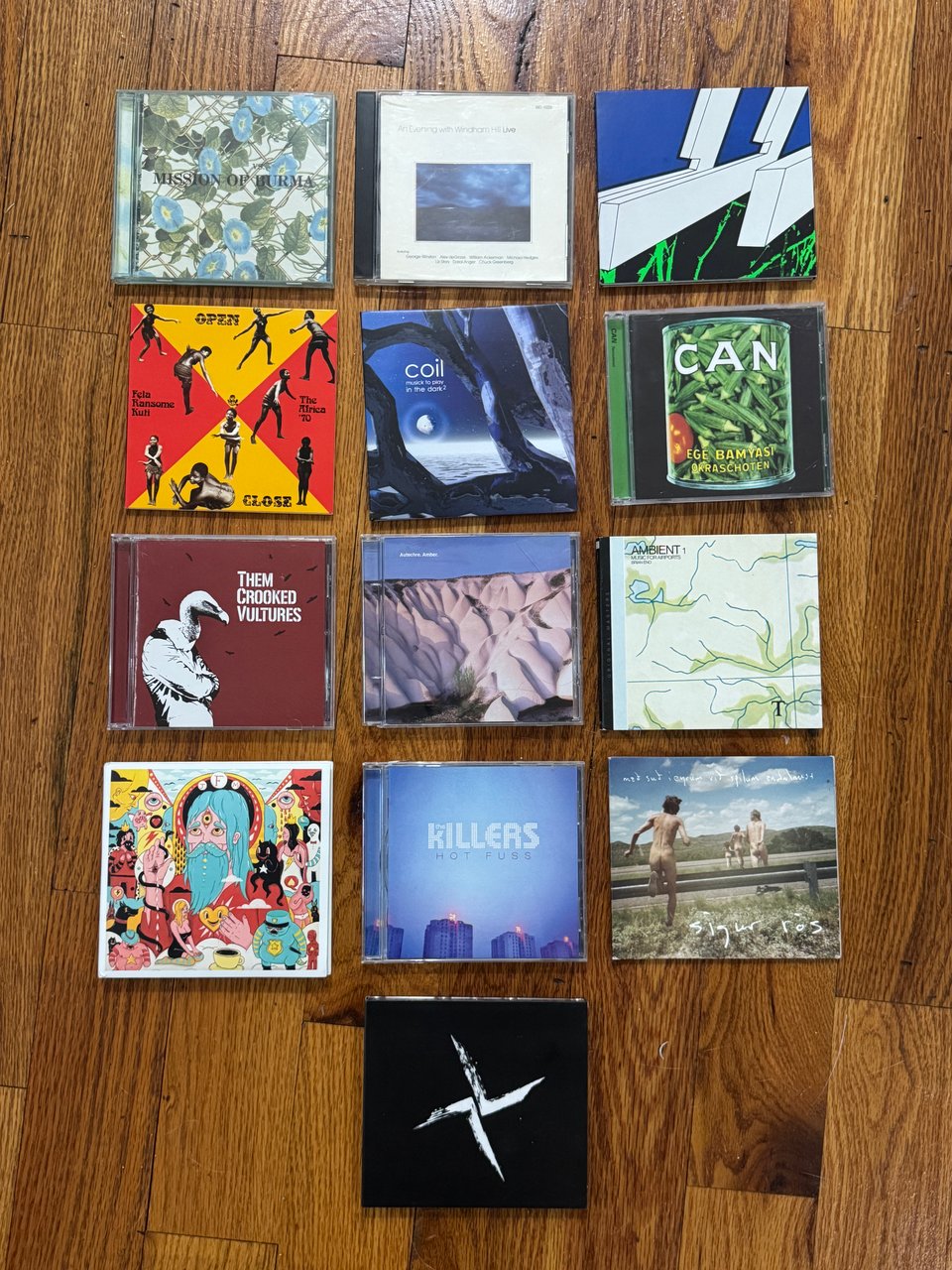 CDs! left to right/top to bottom: Mission of Burma’s VS., An Evening with Windham Hill Live (thank you Kenny!), Oneohtrix Point Never’s Tranquilizer, Fela Kútì’s Open & Close / Afrodisiac, Coil’s Musick to Play in the Dark Vol 2, Can’s Ege Bamyasi, Them Crooked Vultures, Autechre’s Amber, Brian Eno’s Ambient 1: Music for Airports, Father John Misty’s Fear Fun, The Killers’ Hot Fuss, Sigur Rós’s Með suð í eyrum við spilum endalaust, and Burial’s Tunes 2011-2019.