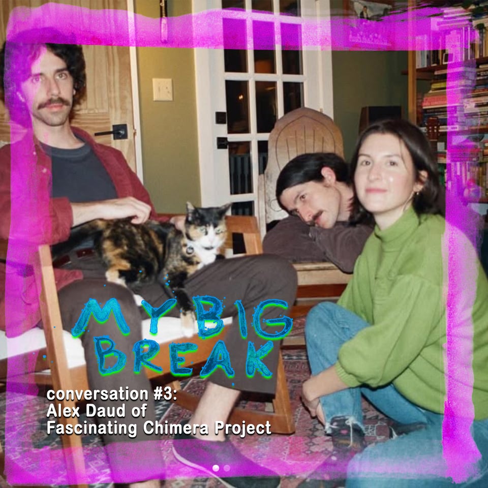 the three members of the band Fascinating Chimera Project pose thoughtfully with a kitty kat, Alex sits on the floor to the right of the frame