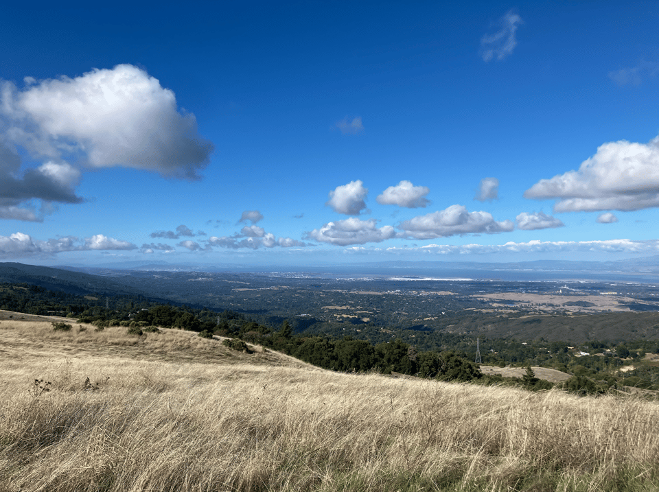 a picturesque landscape with bright blue sky and clouds.