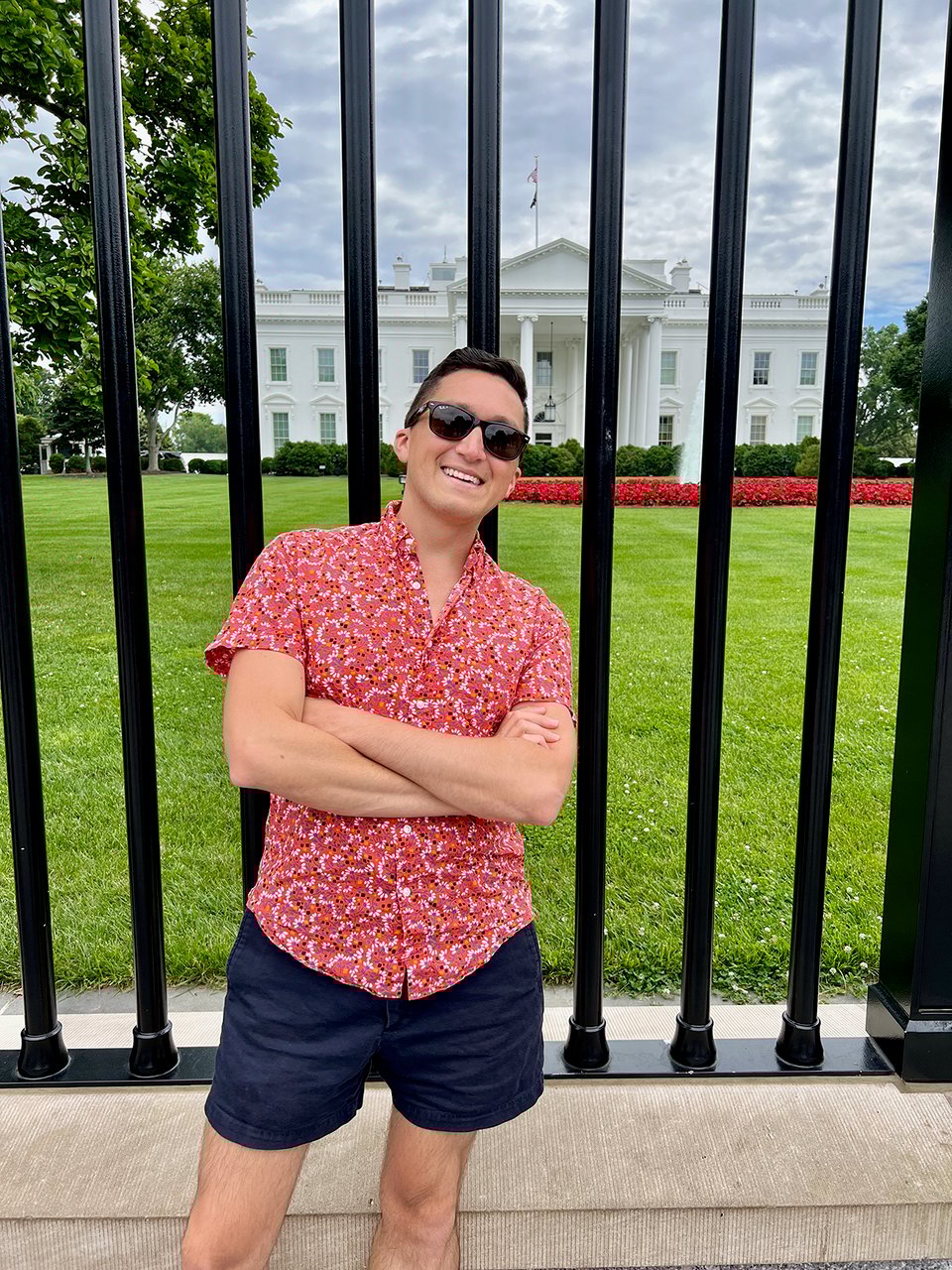 a man standing in front of the white house