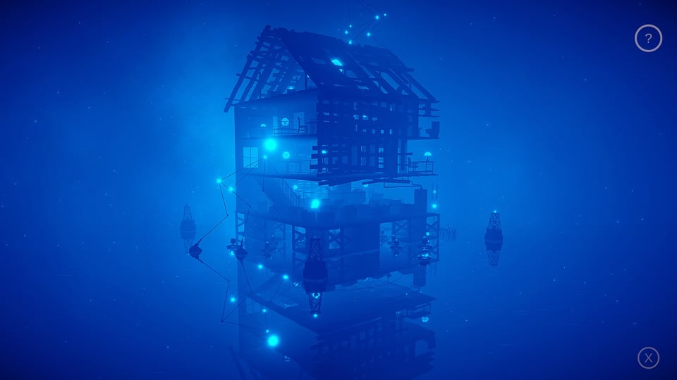 the ruin of a home on the water is filled with lights