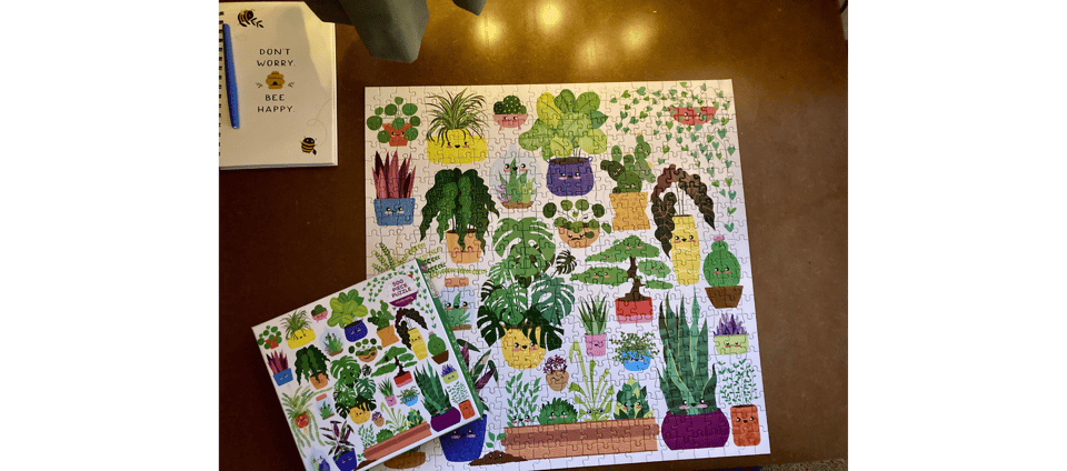 A completed puzzle featuring houseplants