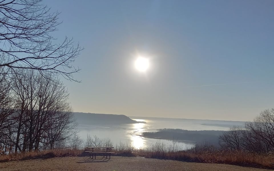 Late December 2023 at Frontenac State Park’s showcase overlook. No snow, and just a skim of ice on Lake Pepin – which soon melted. Photo by Barb Partington