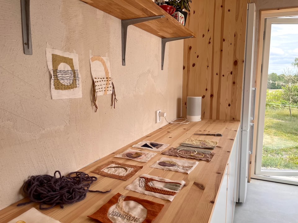 studio room with textile art pieces