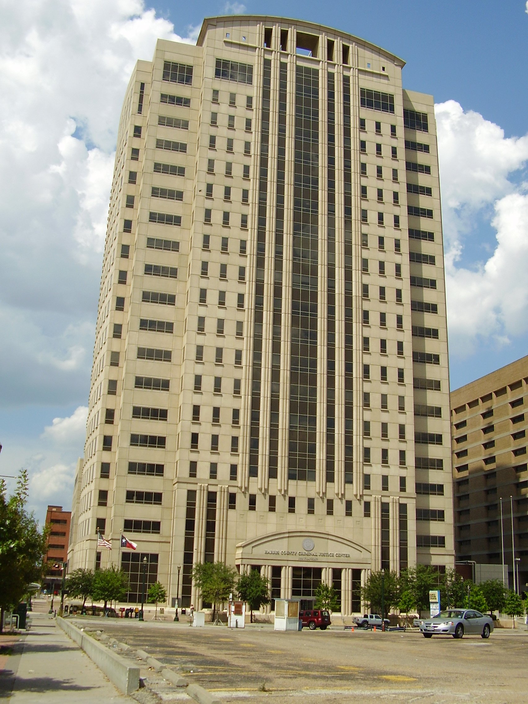 The Harris County Criminal Justice Center, a courts tower in downtown Houston, Texas. The six gang members were convicted of capital murder in Harris County.