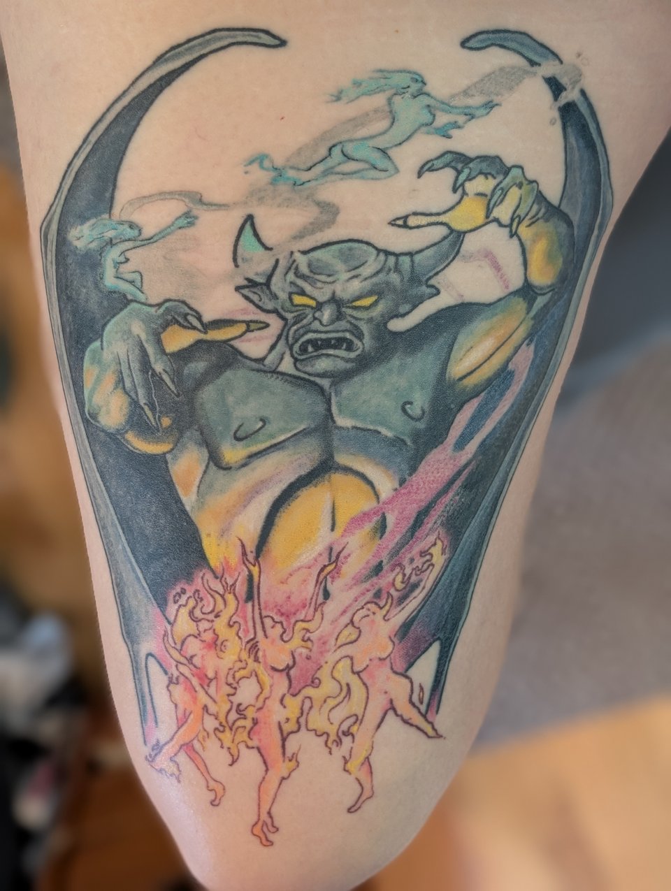 a full color tattoo of Chernabog, a big demon guy from Fantasia, with dancing fire ladies and ghouls flying above his head