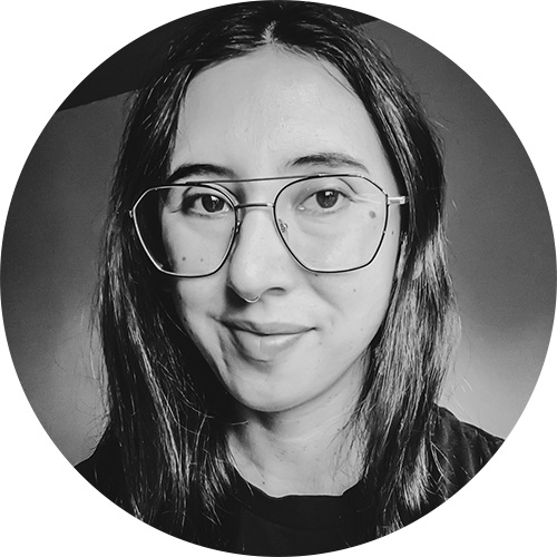 The author in black and white and wearing glasses