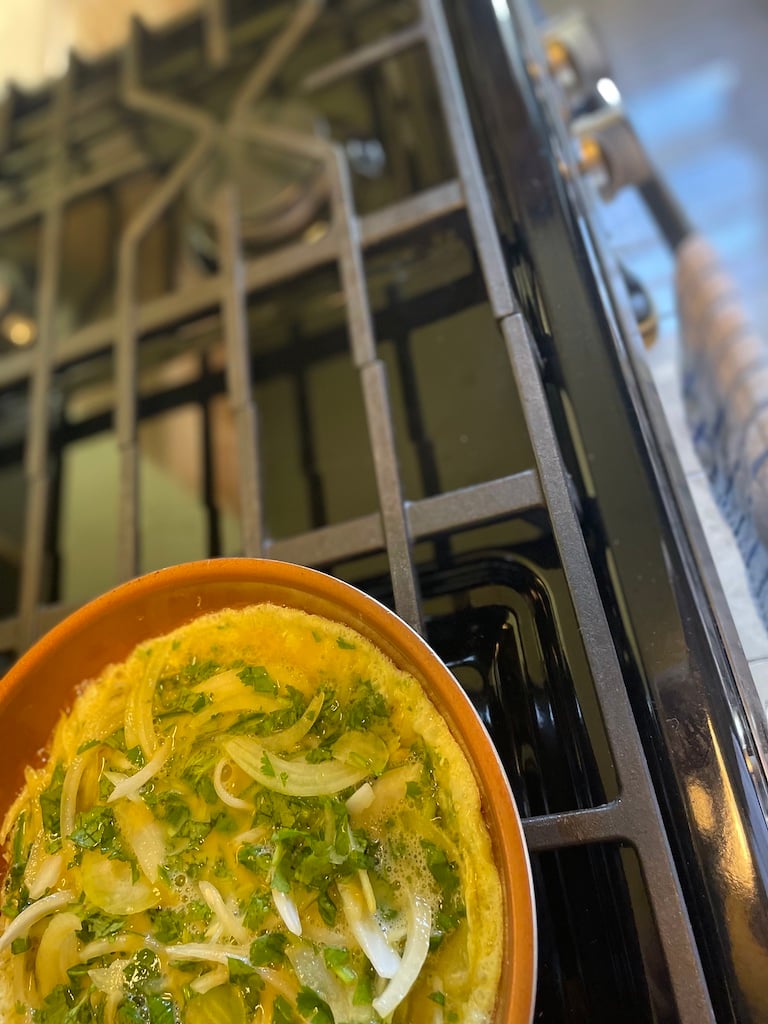 Uncooked omelette not quite in frame