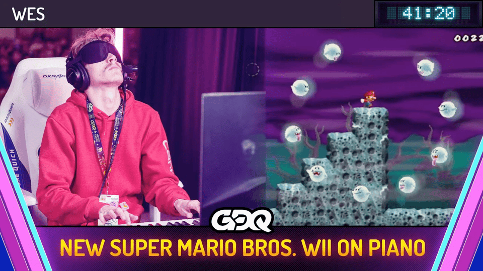 A blindfolded man wearing headphones, playing piano with his head tilted slightly back. Next to the photo, a screenshot of Mario in the middle of a Boo ring. GDQ logo and title New Super Mario Bros. Wii on piano