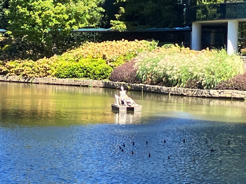 Two skeletons floating on a lake behind the Westin Perimeter Hotel in Atlanta