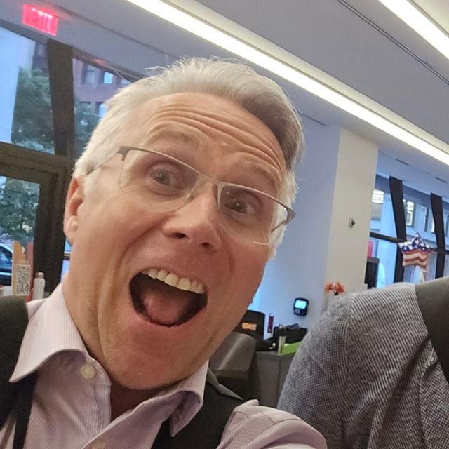 Mark DeLoura taking a selfie and smiling with his mouth wide open.